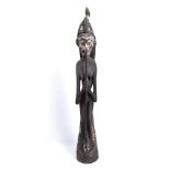 A PAPUA NEW GUINEA TOTEM POLE ANCESTOR FIGURE, carved wood bird type creature grasp to back with