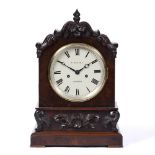 A 19TH CENTURY MAHOGANY TABLE CLOCK the circular dial with Roman numerals inscribed W. Harvey,