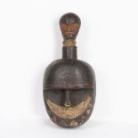 AN AFRICAN HEAD MASK, carved wood with raised handle to head, lacquered finish with old signs of