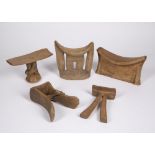 FIVE EAST AFRICAN HEADRESTS, all carved wood, Ethiopian headrest with scratch work decoration (5)