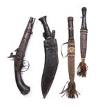 TWO WEST AFRICAN DAGGERS, with leather scabbards together with a Kukri Hanshee and a wooden