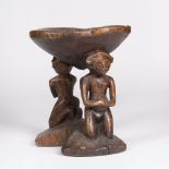 A ZANDE STOOL, Democratic Republic of the Congo,carved wood with male and female figures, diameter