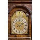 AN EARLY 18TH CENTURY WALNUT AND FEATHER BANDED LONGCASE CLOCK, the hood with caddy top