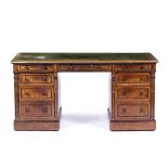 A VICTORIAN FIGURED WALNUT TWIN PEDESTAL DESK with greek key gilt tooled green hide inset top over