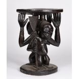 A LUBA-HEMBA STOOL, Democratic Republic of the Congo, carved wood Janiform, one figure with