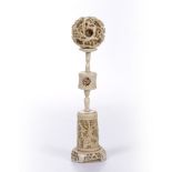 A LATE 19TH CENTURY/EARLY 20TH CENTURY CHINESE IVORY PUZZLE BALL, the ball intricately carved and