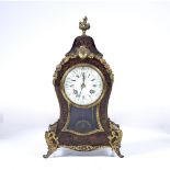 A 19TH CENTURY RED TORTOISESHELL AND BOULLEWORK MANTEL CLOCK of balloon shape with gilt metal