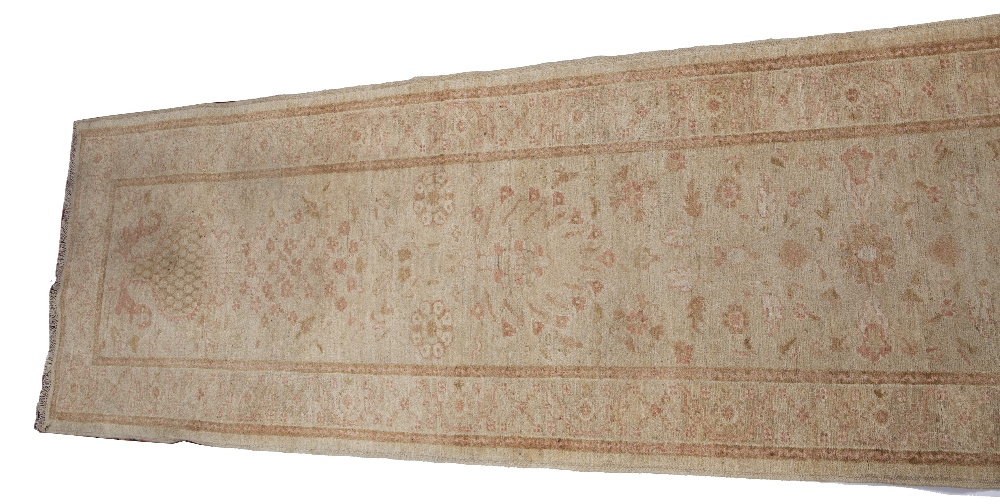 A ZIEGLER PALE GREEN GROUND RUNNER with a pastel flower ornament within a wide border, 391cm x 88cm - Image 4 of 4