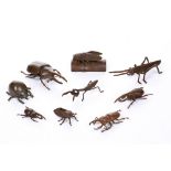 A BRONZE MINIATURE FIGURE OF A BEETLE, its back hinged as a box, 11.5cm long; and a collection of