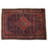 A HAMADAN BLUE GROUND RUG with a central large brick ground medallion within a triple border,