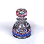 A MILLEFIORE GLASS INKWELL AND STOPPER with polychrome canes and central B cane, possibly