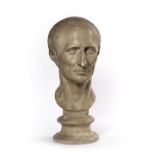 AFTER THE ANTIQUE A PLASTER PORTRAIT BUST OF JULIUS CEASAR, indistinctly signed, 49cm high