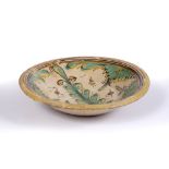 AN 18TH CENTURY SPANISH TALAVERA DISH, tin-glazed with green stylised cactus circa 1740, 24.5cm wide