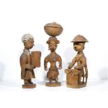 THREE THOMAS ONA CARVED WOODEN FIGURES, seated figure of a district officer (D.O.) with hat, a judge