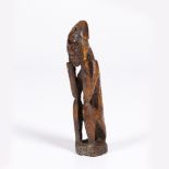 A DEMOCRATIC REPUBLIC OF CONGO LEGA BONE FIGURE, in the form of a crouching man with his hands to