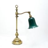 A BRASS LIBRARY DESK LAMP, with green shade, 57cm high