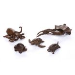 A BRONZE MINIATURE FIGURE OF A CRAB EMERGING FROM A LILY LEAF, 11cm, another similar figure and an