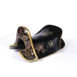 AN EARLY 20TH CENTURY CHINESE BLACK LACQUER SADDLE, painted and gilt heightened with dragons,