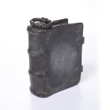 AN ANTIQUE GERMAN PEWTER FLASK in the form of a leather bound book with coat of arms to the front