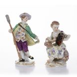 A PAIR OF MEISSEN FIGURES modelled as a gardener with female companion, impressed numerals 20 and 17