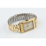 A GENTLEMAN'S 9CT GOLD CASED WRISTWATCH BY TUDOR, the rectangular silvered dial with gilt Arabic