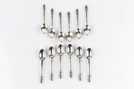 A SMALL COLLECTION OF SILVER, comprising two sets of six apostle topped coffee spoons, a Victoria