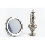 A LATE VICTORIAN SILVER BALUSTER SUGAR CASTOR, with spirally lobed decoration, maker J.G probably