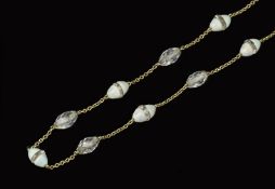 AN OPAL AND ROCK CRYSTAL BEAD NECKLACE, the trace-link chain alternately spaced with conical opal