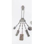 A LATE VICTORIAN SILVER CHATELAINE, pierce decorated with flowers and foliage within a beaded oval