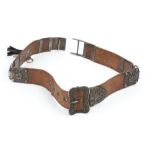 A VICTORIAN SILVER MOUNTED LEATHER BELT, with two piece clasp to one side, buckle and keeper to