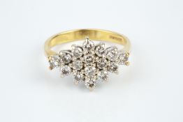 A DIAMOND CLUSTER RING, the lozenge-shaped cluster of round brilliant-cut diamonds in claw settings,