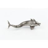 A SPANISH SILVER MODEL, of an articulated fish, with inset cabochon red stone eyes, 12cm long