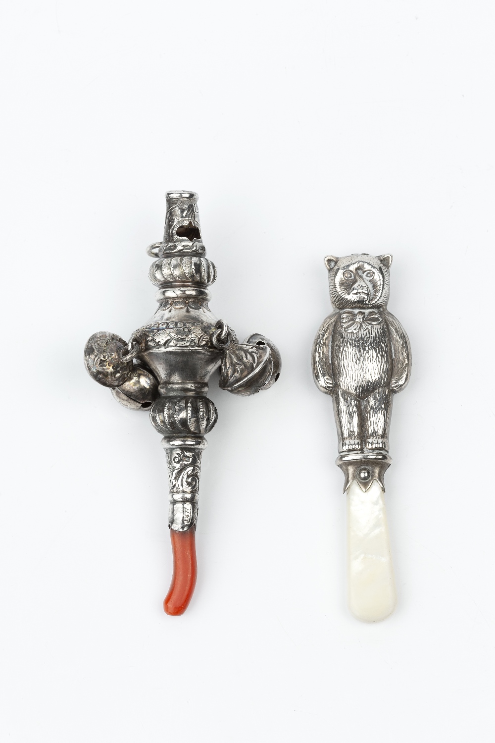 A LATE VICTORIAN SILVER BABY'S RATTLE AND WHISTLE, hung with bells and with coral teether, by