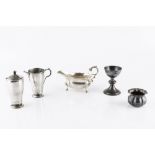 A COLLECTION OF SILVER, comprising an Art Deco style sugar sifter and matching milk jug, by Adie