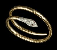 A DIAMOND SET SERPENT BRACELET, modelled as a coiled snake, his head pavé set with rose-cut diamonds