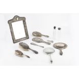 A LATE 19TH CENTURY SILVER MOUNTED EASEL DRESSING TABLE MIRROR, with arched top, pierced and