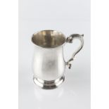 A GEORGE III SILVER MUG of baluster form, with leaf capped scroll handle, maker's mark partly