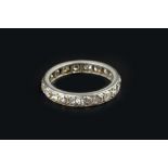A DIAMOND FULL HOOP ETERNITY RING, set throughout with round brilliant and old-cut diamonds, white