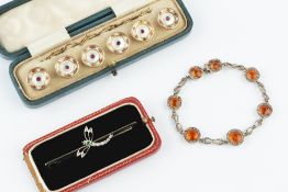 A COLLECTION OF JEWELLERY, comprising a diamond and gem set dragonfly bar brooch, an orange and