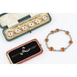 A COLLECTION OF JEWELLERY, comprising a diamond and gem set dragonfly bar brooch, an orange and