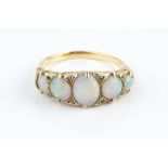 AN OPAL FIVE STONE RING, the oval and circular cabochon opals spaced by rose-cut diamonds points,
