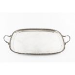 A SILVER TWIN HANDLED TEA TRAY, with gadrooned border and handles, by Thomas Bradbury & Sons Ltd,