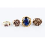 A COLLECTION OF DRESS RINGS, comprising a ruby and diamond half hoop ring, stamped '750', a blue