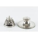 A LATE VICTORIAN SILVER MOUNTED TORTOISESHELL INKWELL, of domed capstan form, pierced and embossed