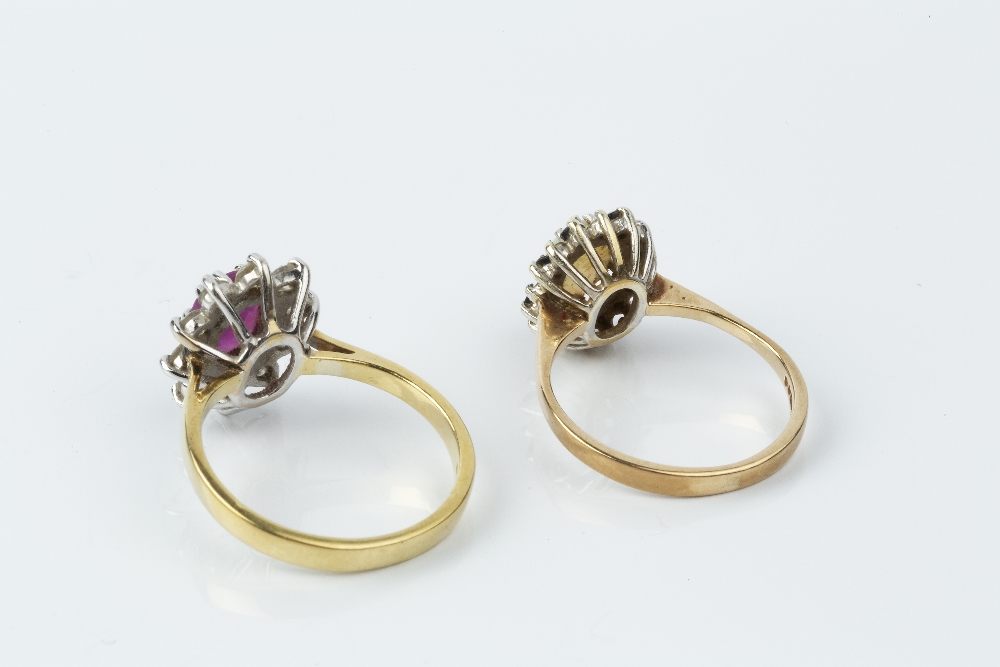 A RUBY AND DIAMOND CLUSTER RING, the oval mixed-cut ruby claw set within a round brilliant-cut - Image 2 of 2