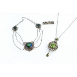 AN ARTS AND CRAFTS PENDANT NECKLACE, designed as a trio of hammered panels, each centred with a