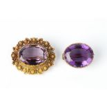A 19TH CENTURY AMETHYST PANEL BROOCH, circa 1820-30, the oval mixed-cut amethyst bordered by