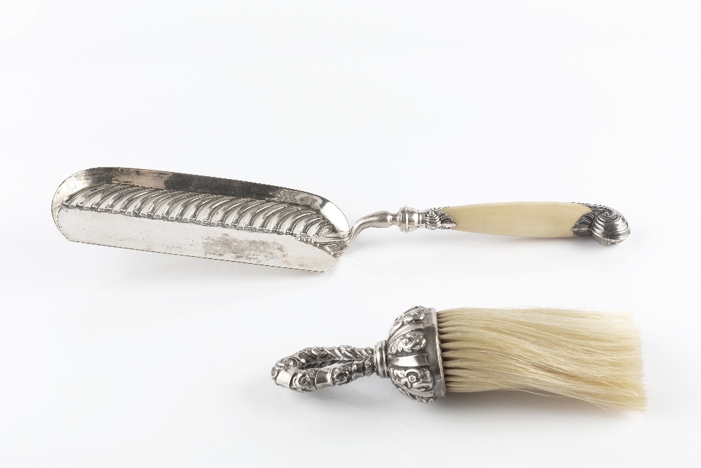 A SILVER CRUMB SCOOP, with lobed decoration and ivory handle, by William Hutton & Sons Ltd, London