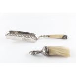 A SILVER CRUMB SCOOP, with lobed decoration and ivory handle, by William Hutton & Sons Ltd, London