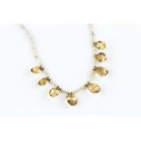 A CITRINE AND SEED PEARL FRINGE NECKLACE, the fringe of graduated oval mixed-cut citrines